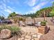 Cozy patio area featuring decorative stone, a pergola and comfortable seating at 10501 W Wilshire Dr, Avondale, AZ 85392