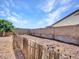 Partially fenced backyard featuring low maintenance landscaping at 10501 W Wilshire Dr, Avondale, AZ 85392