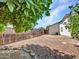 Backyard featuring low maintenance desert landscaping and wood fence at 10501 W Wilshire Dr, Avondale, AZ 85392