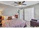 Bedroom with a ceiling fan, ensuite bathroom, and a walk-in closet at 10501 W Wilshire Dr, Avondale, AZ 85392