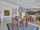 This dining area features a square table for four and a stylish rug at 10501 W Wilshire Dr, Avondale, AZ 85392