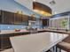 Spacious kitchen with stainless steel appliances and a large center island with barstool seating at 10501 W Wilshire Dr, Avondale, AZ 85392