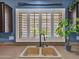 Close-up of the kitchen sink with window and white shutters and a beautiful outdoor view at 10501 W Wilshire Dr, Avondale, AZ 85392