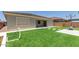 A well maintained backyard with artificial grass, a basketball hoop and a soccer net at 11015 E Texas Ave, Mesa, AZ 85212
