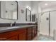 Bathroom with double vanity and glass enclosed shower at 11015 E Texas Ave, Mesa, AZ 85212