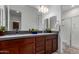 Bathroom features a double vanity and glass enclosed shower at 11015 E Texas Ave, Mesa, AZ 85212