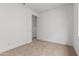 This bedroom features neutral carpet, white walls, and standard outlets at 11015 E Texas Ave, Mesa, AZ 85212
