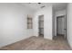 A bedroom featuring neutral carpet, a window and closet with shelving at 11015 E Texas Ave, Mesa, AZ 85212