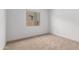 This bedroom boasts neutral carpet, and a window that provides natural light at 11015 E Texas Ave, Mesa, AZ 85212