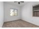 This bedroom features a window with a view of the outside at 11015 E Texas Ave, Mesa, AZ 85212