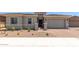Charming single-Gathering home showcasing a two-car garage, landscaped yard, and a secure gated entrance at 11015 E Texas Ave, Mesa, AZ 85212