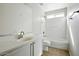 Well-lit bathroom features a shower-tub combo and a vanity with a sink at 118 N 223Rd Ave, Buckeye, AZ 85326