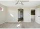 Neutral carpet, adjacent closet, and entrance create a welcoming, functional bedroom space at 118 N 223Rd Ave, Buckeye, AZ 85326