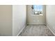 Neutral bedroom with carpeted floors and a window at 118 N 223Rd Ave, Buckeye, AZ 85326