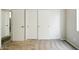 Bedroom featuring white closet doors and carpeted floors at 118 N 223Rd Ave, Buckeye, AZ 85326