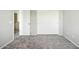 Bedroom with neutral walls, carpet flooring, and closet with sliding doors at 118 N 223Rd Ave, Buckeye, AZ 85326