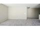 Neutral bedroom with carpeted floors at 118 N 223Rd Ave, Buckeye, AZ 85326