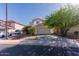 Charming two-story home featuring a spacious two-car garage and well-maintained front yard landscaping at 118 N 223Rd Ave, Buckeye, AZ 85326