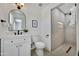 Well-lit bathroom with modern vanity, toilet, and a spacious walk-in shower offering a sleek and comfortable design at 132 W Orchid Ln, Chandler, AZ 85225