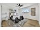 Bright bedroom with a queen bed, neutral decor, and wood floors for a cozy and serene atmosphere at 132 W Orchid Ln, Chandler, AZ 85225