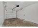 Clean garage features a white door and finished walls at 132 W Orchid Ln, Chandler, AZ 85225