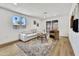 A comfortable living room with wood floors, neutral furnishings, and natural light at 132 W Orchid Ln, Chandler, AZ 85225