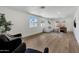 Spacious living room featuring hardwood floors, ample natural light, and a comfortable seating arrangement at 132 W Orchid Ln, Chandler, AZ 85225