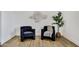 Cozy sitting area with stylish chairs, wood flooring, and tasteful decor for a relaxing ambiance at 132 W Orchid Ln, Chandler, AZ 85225