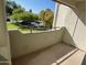Balcony with view of the manicured lawn and mature trees providing a private and relaxing outdoor area at 1825 W Ray Rd # 2082, Chandler, AZ 85224