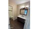 Bathroom featuring an updated vanity, mirror, and lighting fixtures, alongside a pristine toilet and tub/shower at 1825 W Ray Rd # 2082, Chandler, AZ 85224