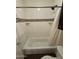 Bathroom tub and shower with a decorative tile accent at 1825 W Ray Rd # 2082, Chandler, AZ 85224