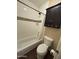 Bathroom showcasing a bathtub with a shower, complemented by updated tiling, toilet, and storage cabinet at 1825 W Ray Rd # 2082, Chandler, AZ 85224