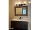 Bathroom featuring a modern vanity with a framed mirror and stylish lighting, offering a serene and inviting space at 1825 W Ray Rd # 2082, Chandler, AZ 85224