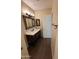 Bathroom featuring a vanity with framed mirror, modern fixtures, and open door providing access to the adjacent areas at 1825 W Ray Rd # 2082, Chandler, AZ 85224