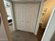 Hallway with closet doors leads to bedroom and bathroom, ensuring comfortable passage between spaces at 1825 W Ray Rd # 2082, Chandler, AZ 85224