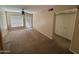 Well-lit living room with neutral carpet and ceiling fan, creating a comfortable and inviting space at 1825 W Ray Rd # 2082, Chandler, AZ 85224