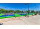 Outdoor community tennis court with green and blue surfaces, perfect for recreation at 1825 W Ray Rd # 2082, Chandler, AZ 85224