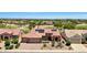 Desert home featuring solar panels, well-manicured landscaping, golf course, and beautiful views at 19745 N Mountain Sage Ln, Surprise, AZ 85374