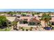 Aerial view of a desert home featuring a tiled roof, desert landscaping, and an outdoor patio at 19745 N Mountain Sage Ln, Surprise, AZ 85374