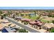 Expansive aerial shot showcasing a desert home with a golf course and scenic views at 19745 N Mountain Sage Ln, Surprise, AZ 85374
