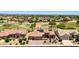 Stunning aerial view of a desert home with solar panels, golf course and scenic views at 19745 N Mountain Sage Ln, Surprise, AZ 85374