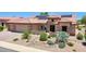 Beautiful desert home featuring a two-car garage, brick paver driveway, and xeriscaping at 19745 N Mountain Sage Ln, Surprise, AZ 85374