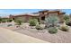 Inviting single-Gathering home featuring xeriscaping, desert plants, and a clay tile roof at 19745 N Mountain Sage Ln, Surprise, AZ 85374
