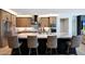 Gourmet kitchen featuring stainless appliances, a stylish range hood, and ample counter space at 19745 N Mountain Sage Ln, Surprise, AZ 85374