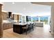 Spacious open concept kitchen with an island, marble countertops, and modern finishes at 19745 N Mountain Sage Ln, Surprise, AZ 85374