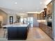 Spacious kitchen with a marble island, stainless steel appliances, and custom cabinets at 19745 N Mountain Sage Ln, Surprise, AZ 85374