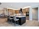 Bright and open kitchen with an island, stainless steel appliances, and lots of cabinet space at 19745 N Mountain Sage Ln, Surprise, AZ 85374