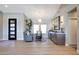 Bright living room featuring wood floors, ample natural light, and modern furniture at 19745 N Mountain Sage Ln, Surprise, AZ 85374