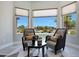 Inviting sitting area with comfortable chairs and a view of the professionally landscaped backyard at 19745 N Mountain Sage Ln, Surprise, AZ 85374