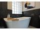 A free standing soaking tub and bamboo tray for all your self care needs! at 19745 N Mountain Sage Ln, Surprise, AZ 85374
